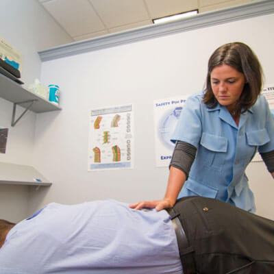 Chiropractor West Bend WI Korie Gardner Schofield Adjusting Patient