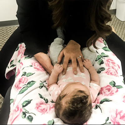 Chiropractor West Bend WI Terry Mellom Adjusting Baby
