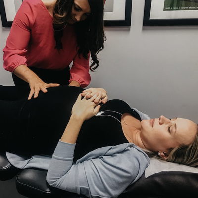Chiropractor West Bend WI Terry Mellom Adjusting Patient